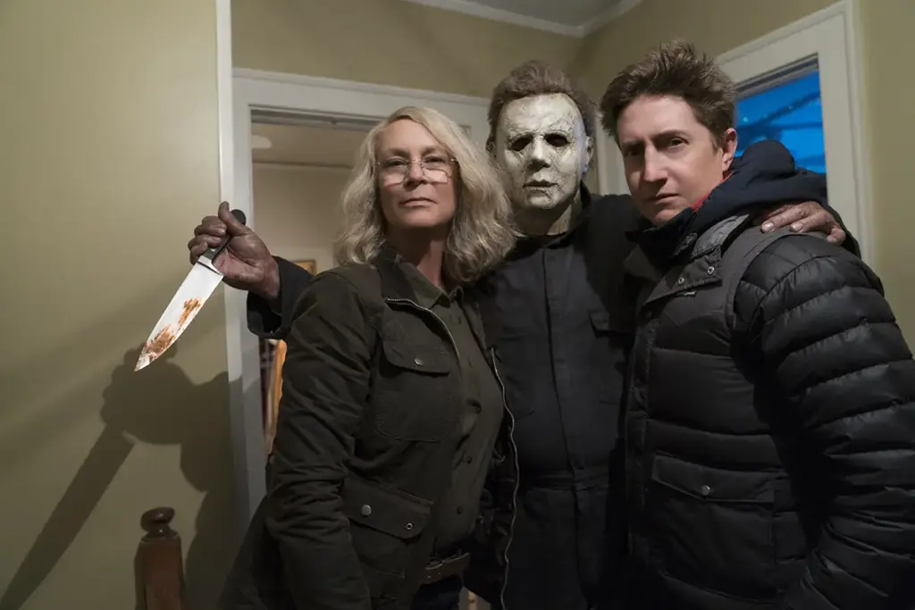 Curtis, Castle and Green in the babysitter house. Green says he was firm about having Castle involved. “While we’re sharing this planet with John Carpenter and Jamie Lee Curtis, and Nick Castle, why not invite them into our creative conversation? It just makes it that much more specific and special.”